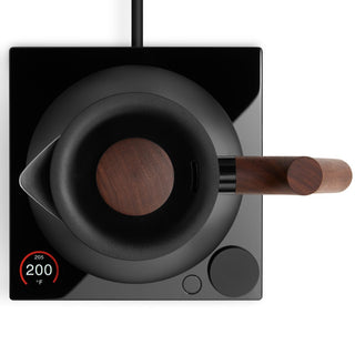 Fellow Corvo EKG Pro Studio Electric Kettle (120V) with wooden handle on black digital base with temperature display