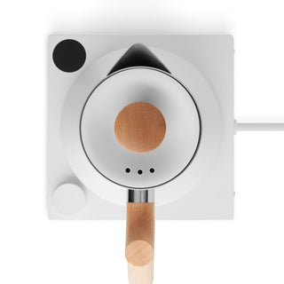 Fellow Corvo EKG Electric Kettle (120V) top view showing stainless steel body and wooden handle on white base