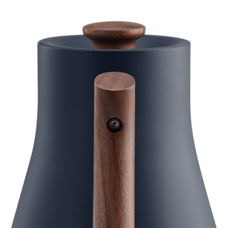 Fellow Corvo EKG Electric Kettle (120V) with smooth navy body and wooden handle detail close-up