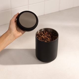 Fellow Electric Atmos Vacuum Canister - Matte Black with stainless steel interior and coffee beans inside