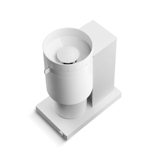 FELLOW Opus Conical Burr Grinder (120V) in white with textured ribbed side panel and dial settings