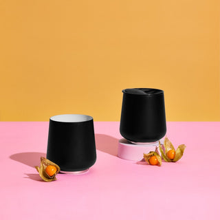 FELLOW Ruby Wine Tumbler (12oz/355ml) black matte stainless steel with lid on pink and yellow background