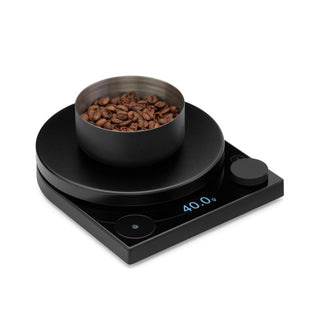 FELLOW Fellow Tally Pro Precision Scale (Studio Edition) in black with stainless steel container holding coffee beans
