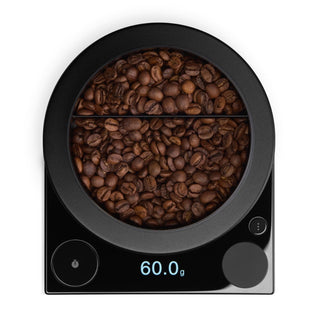 Fellow Tally Pro Precision Scale (Studio Edition) showing 60g coffee beans on stainless steel weighing platform