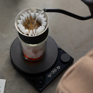 Fellow Tally Pro Precision Scale (Studio Edition) weighing coffee brewing setup with digital display and sleek black design