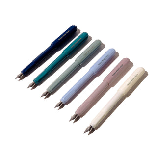 Six colorful fountain pens laid out in a row featuring The Carousel Fountain Pen - After Hours| Ferris Wheel Press design by ferris wheel press.