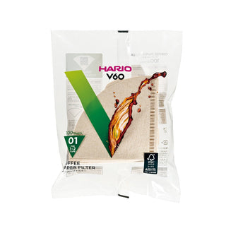 HARIO V60-01 (100 Pack) white paper coffee filters in clear plastic packaging with green and black accents