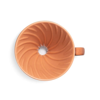 HARIO V60-02 Ceramic Dripper top view showing terracotta porcelain with spiral grooves and central hole