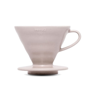 HARIO V60-02 Ceramic Dripper in soft beige porcelain with ergonomic handle and smooth matte finish