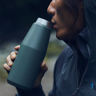KINTO TRAIL Tumbler 580ml held and sipped from, matte green 18-8 stainless steel travel bottle detail