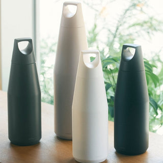 KINTO TRAIL Tumbler 1080ml stainless steel bottles with matte finish in natural lighting on wooden surface