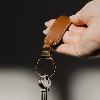 Orbitkey Loop Keychain in brown Nappa leather held by hand with attached keys on metal ring