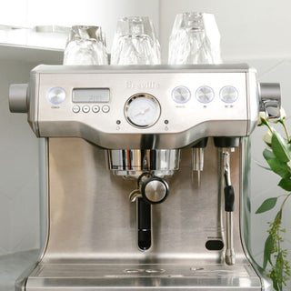 notNeutral VERO Cappuccino Glass 6oz stacked upside down on stainless steel espresso machine top