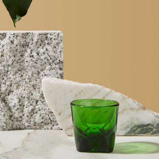 notNeutral VERO Espresso Glass 3oz in vibrant green glass with thick base on marble surface