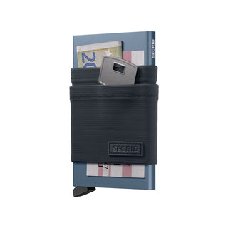 Secrid Flexwallet in Titanium with everyday carry items displayed