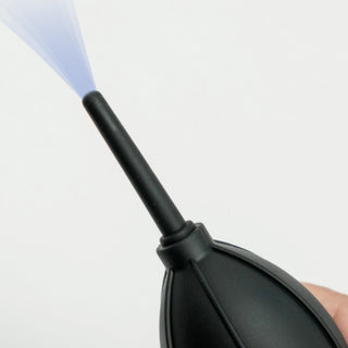 Timemore Air Blower with flexible black silicone nozzle releasing a burst of air for cleaning