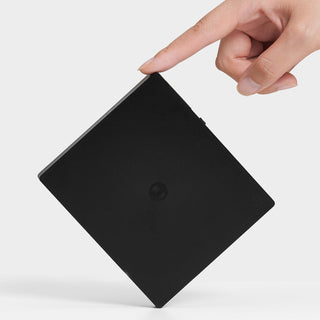 Timemore Black Mirror Mini Coffee Scale shown in sleek black with fingertip poised to tap edge
