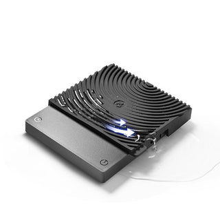 Timemore Black Mirror Mini Coffee Scale with textured black surface and water-resistant design spilling liquid