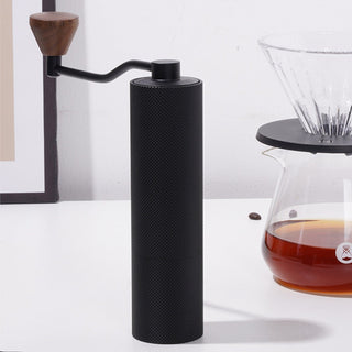 Timemore Chestnut Slim 3 Grinder black aluminum hand grinder with wooden handle on white surface
