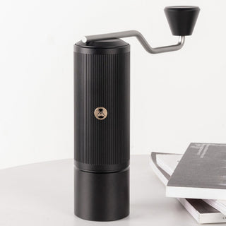 Timemore Chestnut X Lite hand grinder featuring matte black ribbed stainless steel body and ergonomic handle
