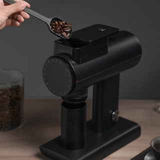 Timemore Sculptor 078S All-Purpose Grinder (120V) with black matte finish and coffee beans being added