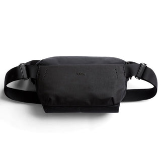 Bellroy Venture Sling 6L in black recycled nylon showing front pouch with adjustable strap buckle