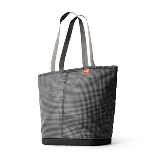 Bellroy Lite Cooler Tote 16L in charcoal with waffle texture and contrast beige handles standing upright