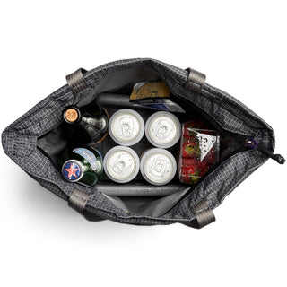Bellroy Lite Cooler Tote 16L in black with insulated interior holding beverages and strawberries