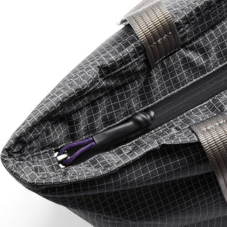 Close-up of black Bellroy Lite Cooler Tote 16L showing textured recycled nylon fabric and zipper pull detail