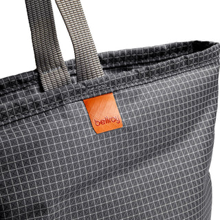Bellroy Lite Cooler Tote 16L in textured dark fabric with grid pattern and leather logo patch