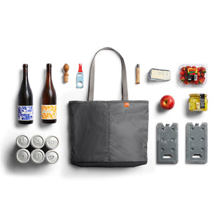 Bellroy Lite Cooler Tote 16L in gray fabric with handles, displayed with drinks and cooling blocks alongside